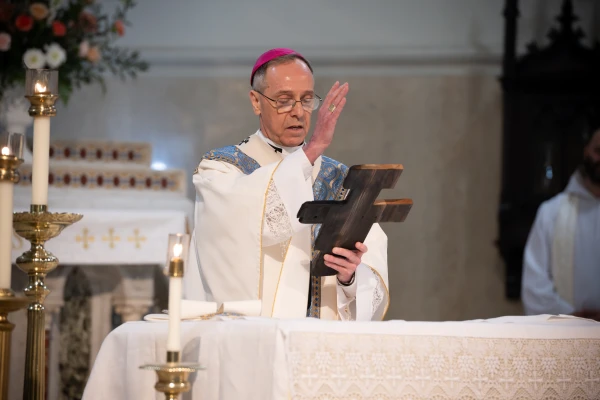 Archbishop Charles C. Thompson blesses a cross that was made from wood from the most recent fires in California and will accompany pilgrims on the St. Katharine Drexel Route. May 18, 2025. Credit: Jeffrey Bruno