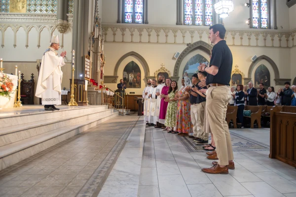 The perpetual pilgrims of the St. Katharine Drexel Route stand before Archbishop Charles C. Thompson to be commissioned for their six-week journey across the country. May 18, 2025. Credit: Jeffrey Bruno