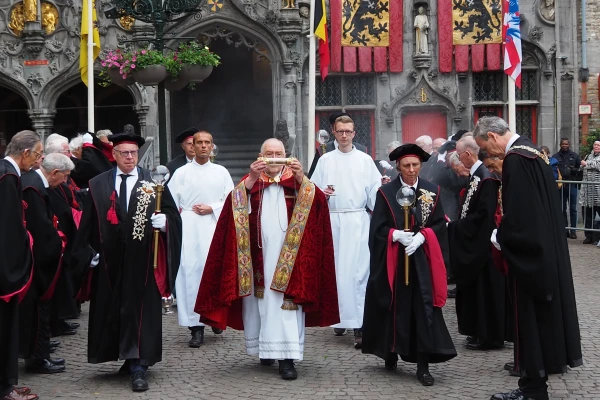 The vial containing the cloth with the Holy Blood is carried from the basilica by the brotherhood after morning Mass. May 28, 2025. Credit: Thomas P. Reiter