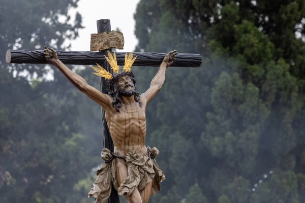 A crucifix is held aloft during the grand procession of the Jubilee of Confraternities in Rome, Saturday, May 17, 2025. Credit: Daniel Ibáñez/CNA
