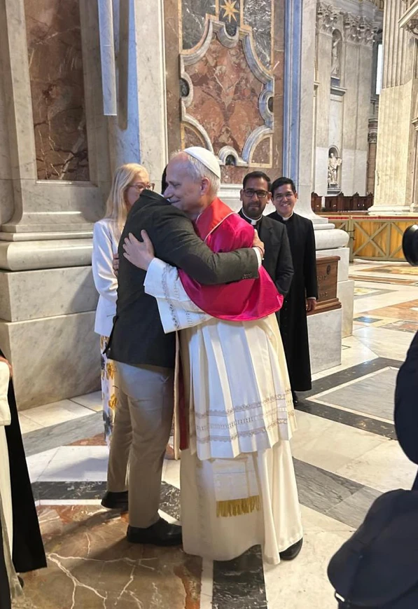 Pope Leo XIV embraces Delgado at the end of the May 18 Mass inaugurating his pontificate. Credit: Courtesy of Edinson Delgado
