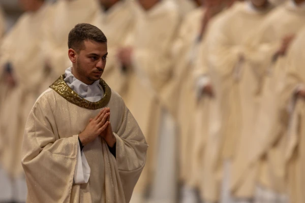 A newly ordained priest prays during the ordination Mass celebrated by Pope Leo XIV at St. Peter's Basilica on May 31, 2025. Credit: Daniel Ibáñez/CNA