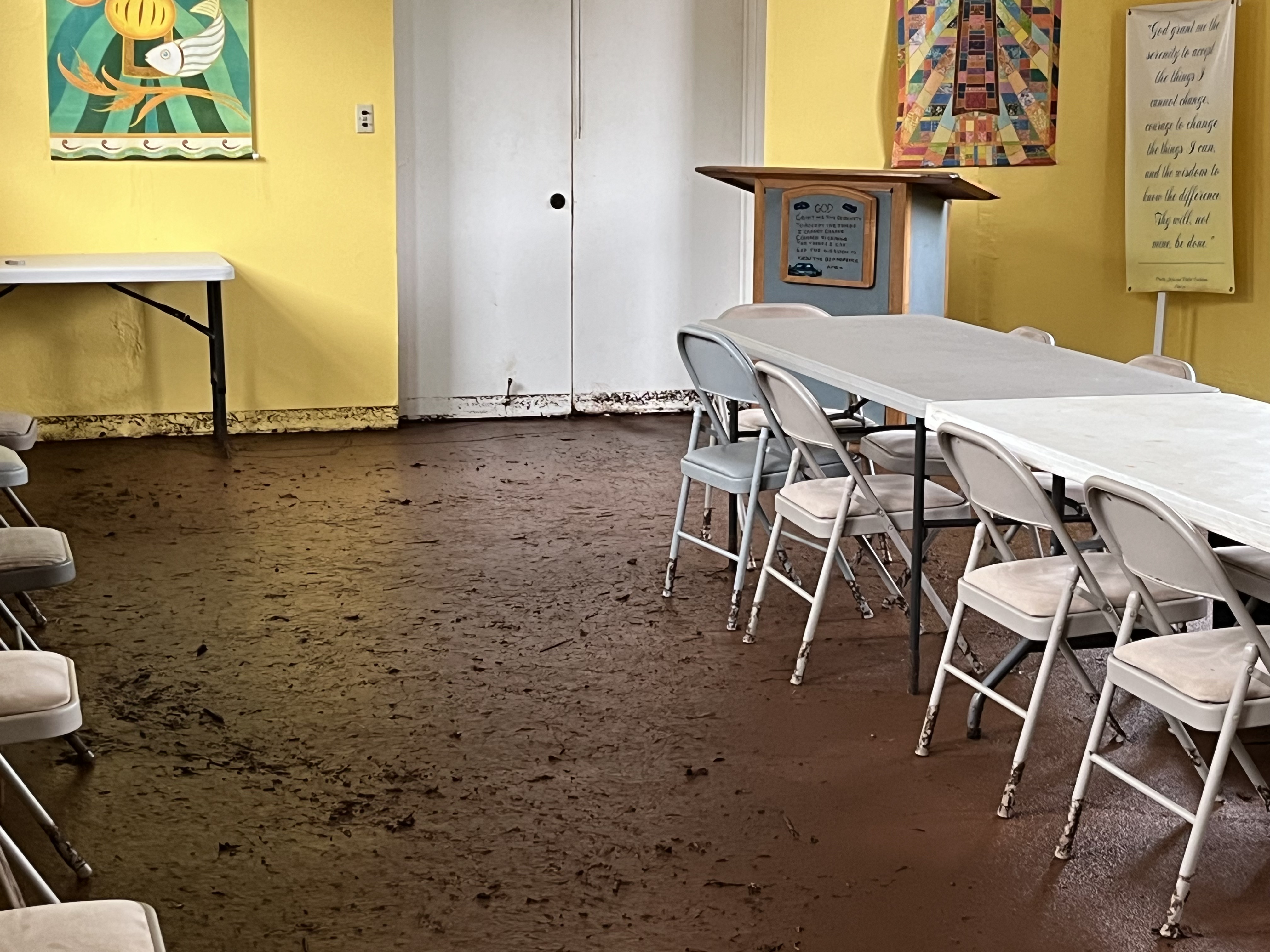 Mud cakes the floors in the hall of Sts. Peter and Paul Parish Mission on the North Shore of Oahu, Hawaii, after devastating storms in March 2026. | Credit: Photo courtesy of Sts. Peter and Paul Parish Mission
