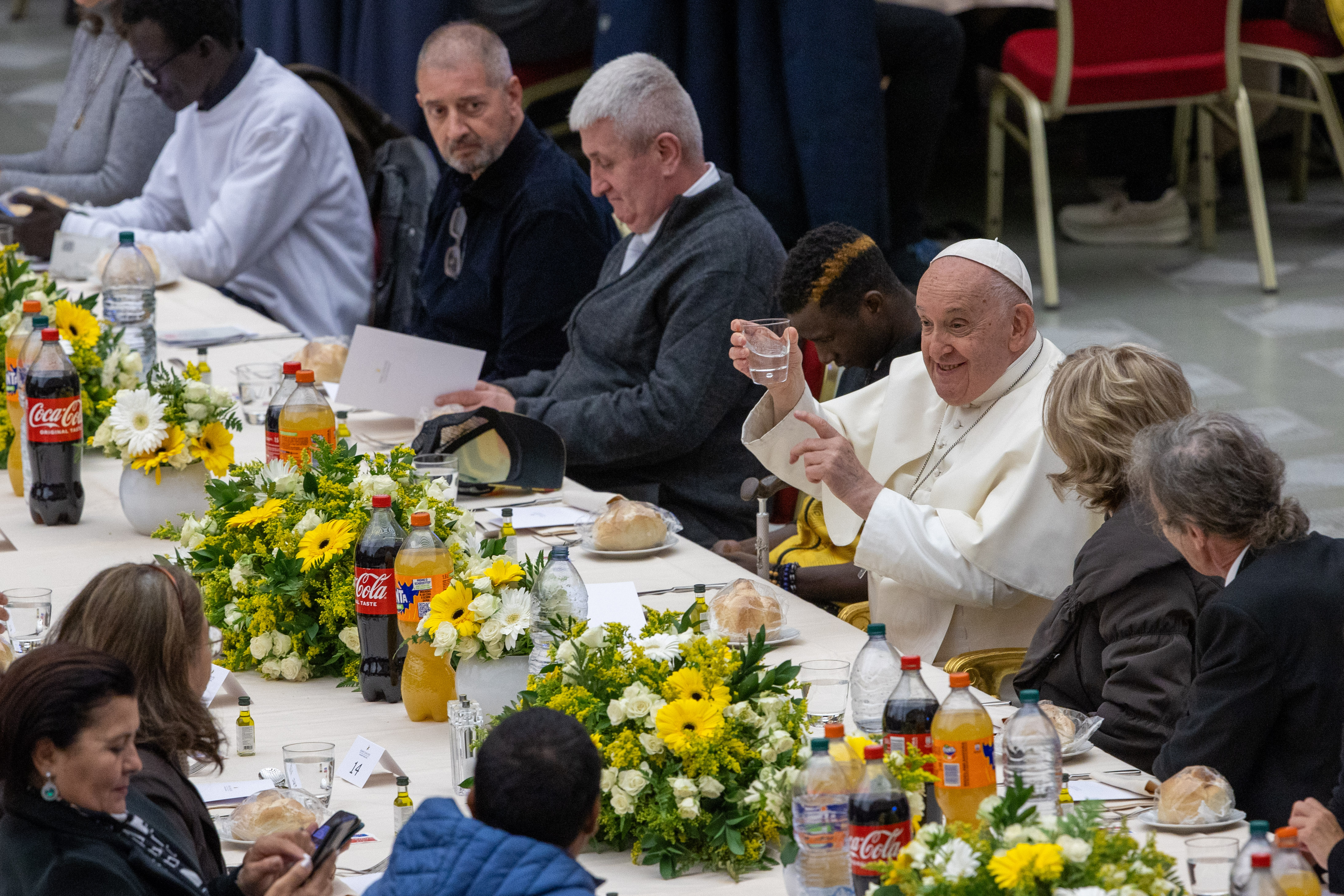 Pope Francis raises his glass at the start of a lunch with poor and economically disadvantaged people in the Vatican’s Paul VI Hall on Nov. 19, 2023. | Credit: Daniel Ibanez/CNA