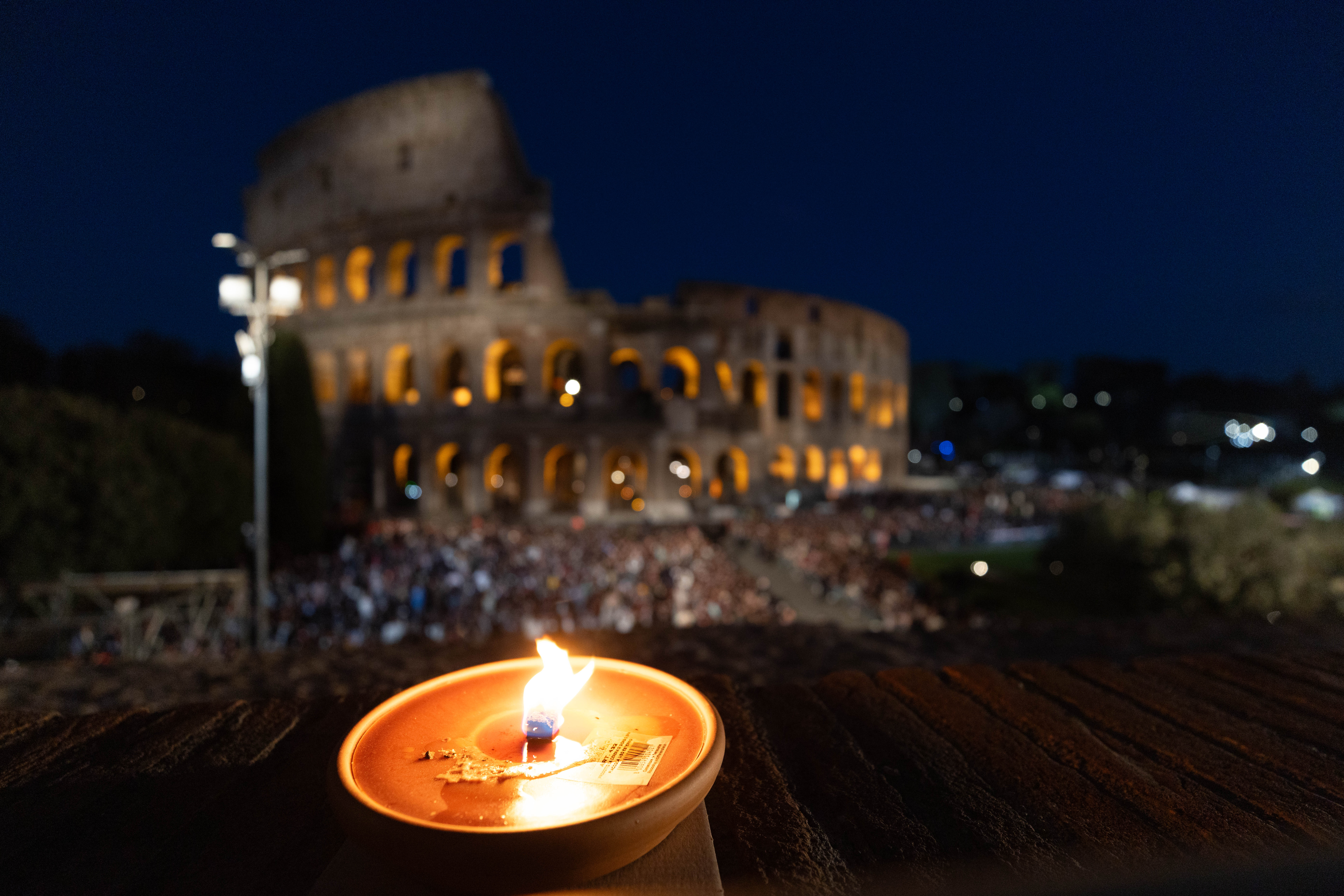 A candle flickers at the Colosseum in Rome on Good Friday, April 3, 2026. | Credit: Daniel Ibáñez/EWTN News