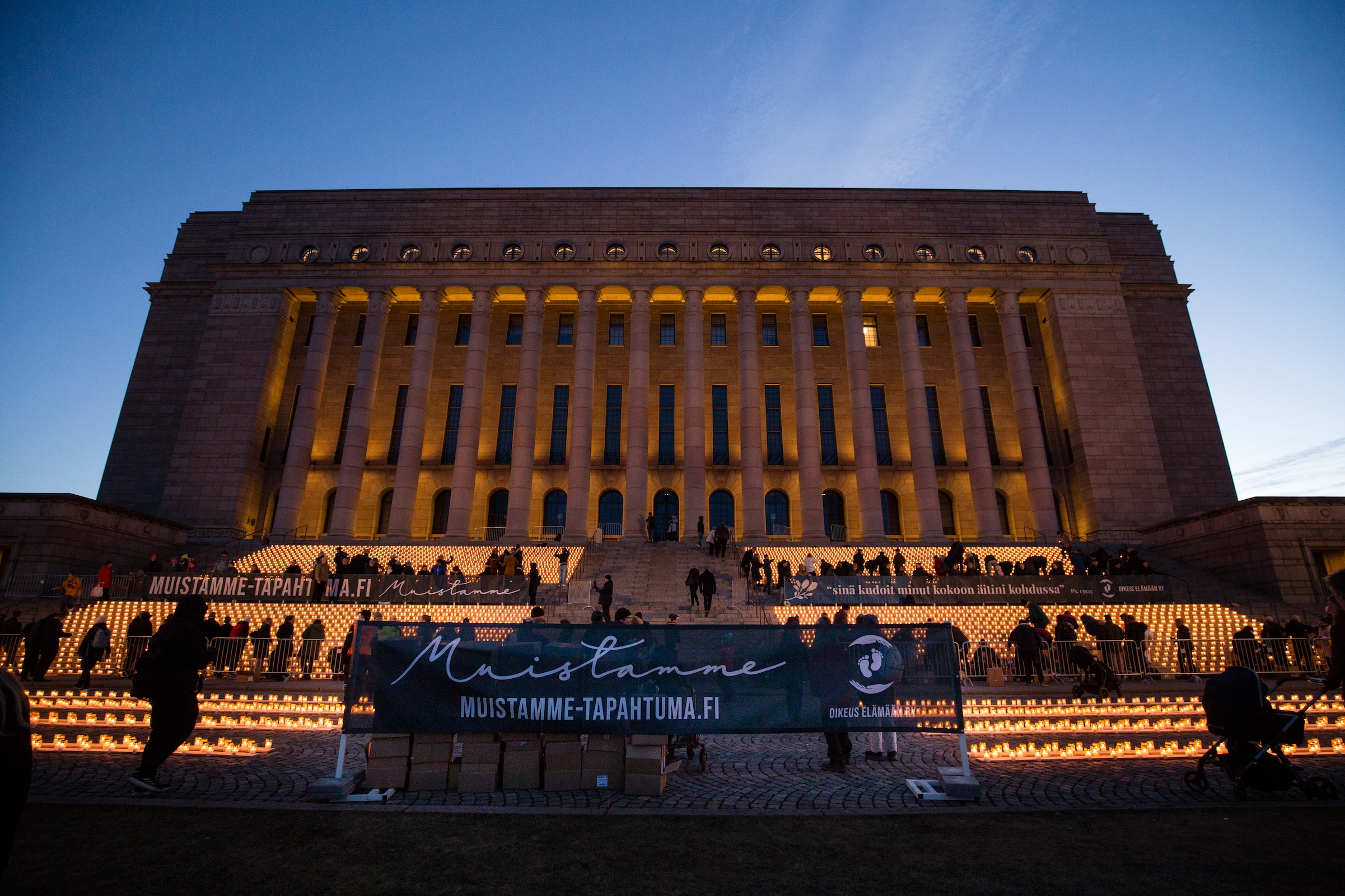 The full display of 8,645 candles glows on the steps of Finland’s Parliament in Helsinki on the night of March 21, 2026. | Credit: Jaakko Haapanen