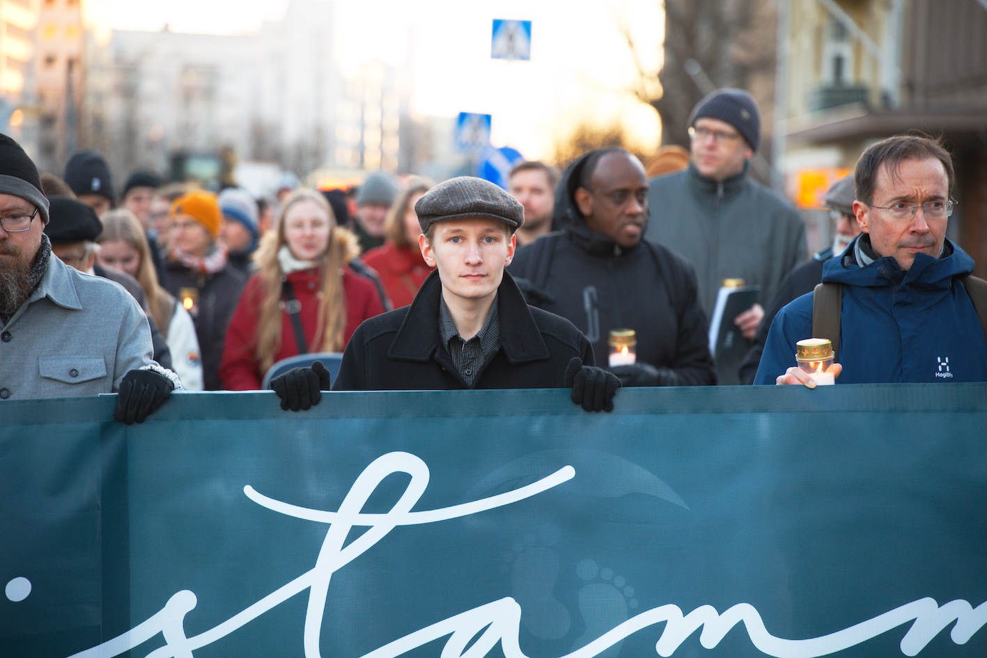 Pro-life advocates carry the “Muistamme” banner through central Helsinki during the candlelit vigil on March 21, 2026. | Credit: Miika Soininen