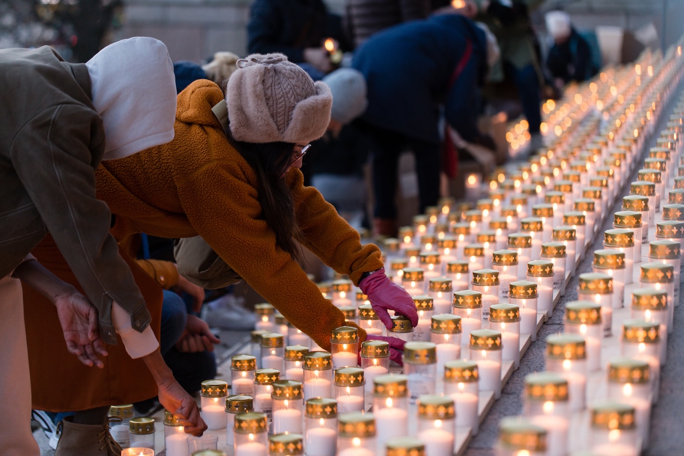 Participants light some of the 8,645 candles on the steps of Finlandʼs Parliament in Helsinki on March 21, 2026, one for each abortion performed in Finland in 2024. | Credit: Jaakko Haapanen