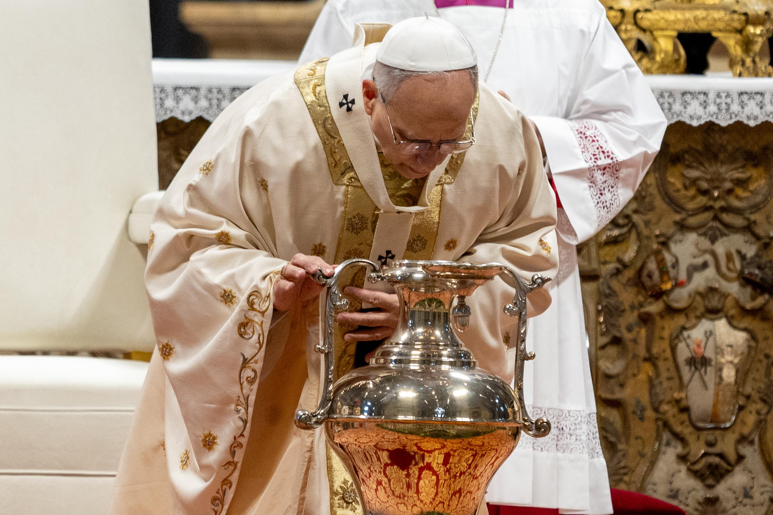 Pope Leo XIV breathes over oil during a chrism Mass at the Vatican on Holy Thursday, April 2, 2026. | Credit: Daniel Ibáñez/EWTN News