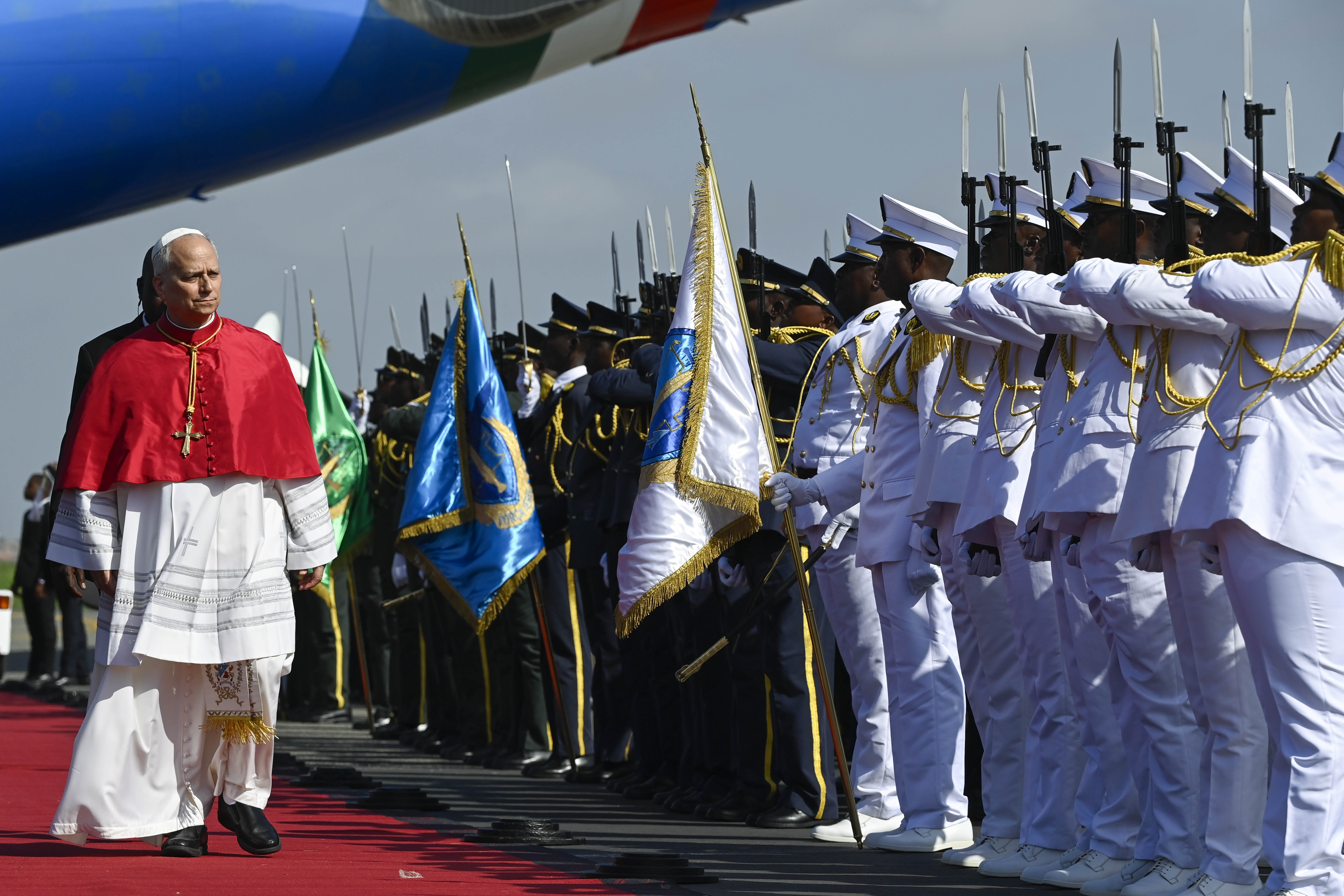 Pope Leo XIV receives a ceremonial greeting upon his arrival at Quatro de Fevereiro Airport in Luanda, Angola, Saturday, April 18, 2026. | Credit: Vatican Media