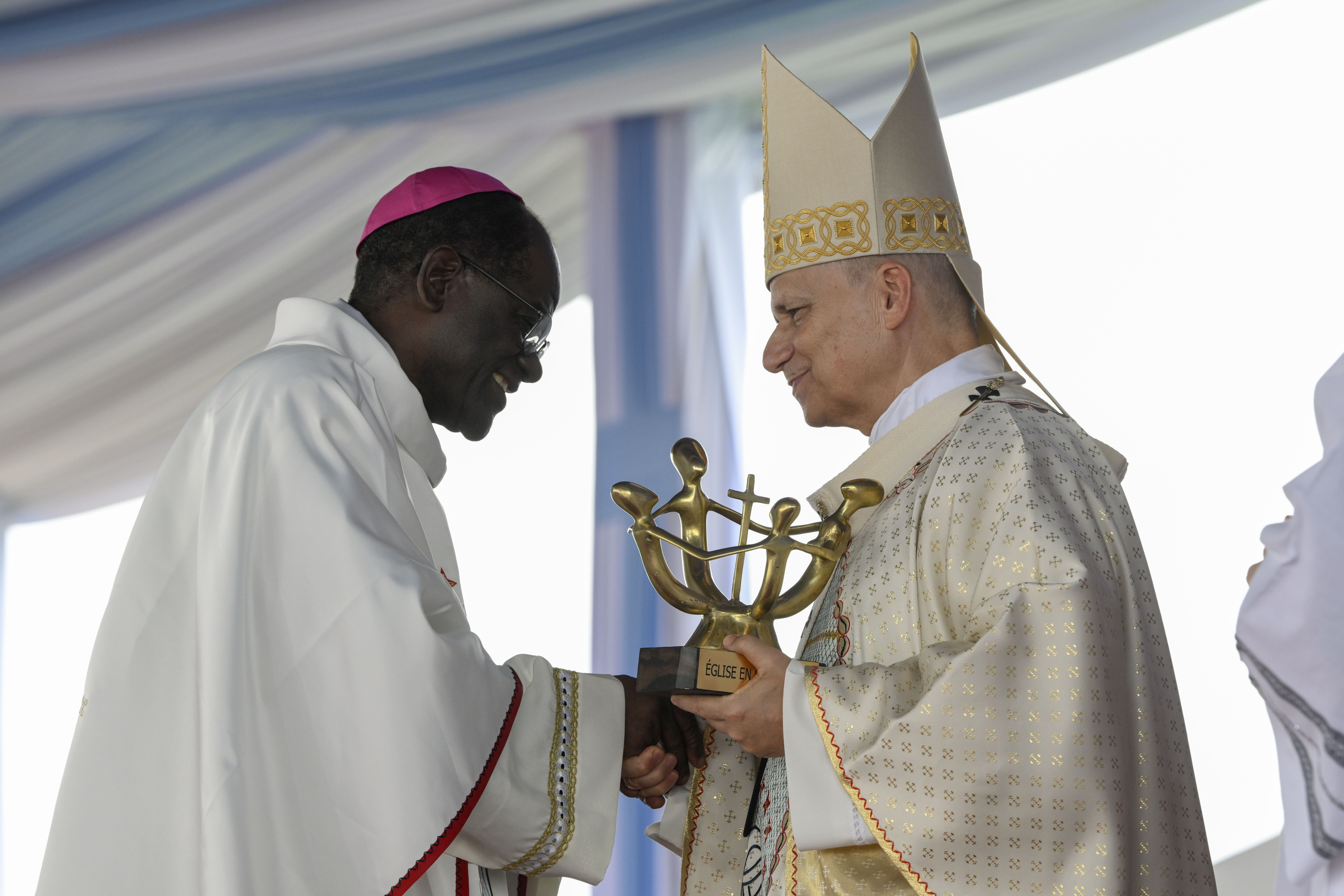 Pope Leo XIV greets Archbishop of Yaoundé Monsignor Jean Mbarga during Holy Mass at Yaoundé-Ville Airport in Cameroon, Saturday, April 18, 2026. | Credit: Vatican Media