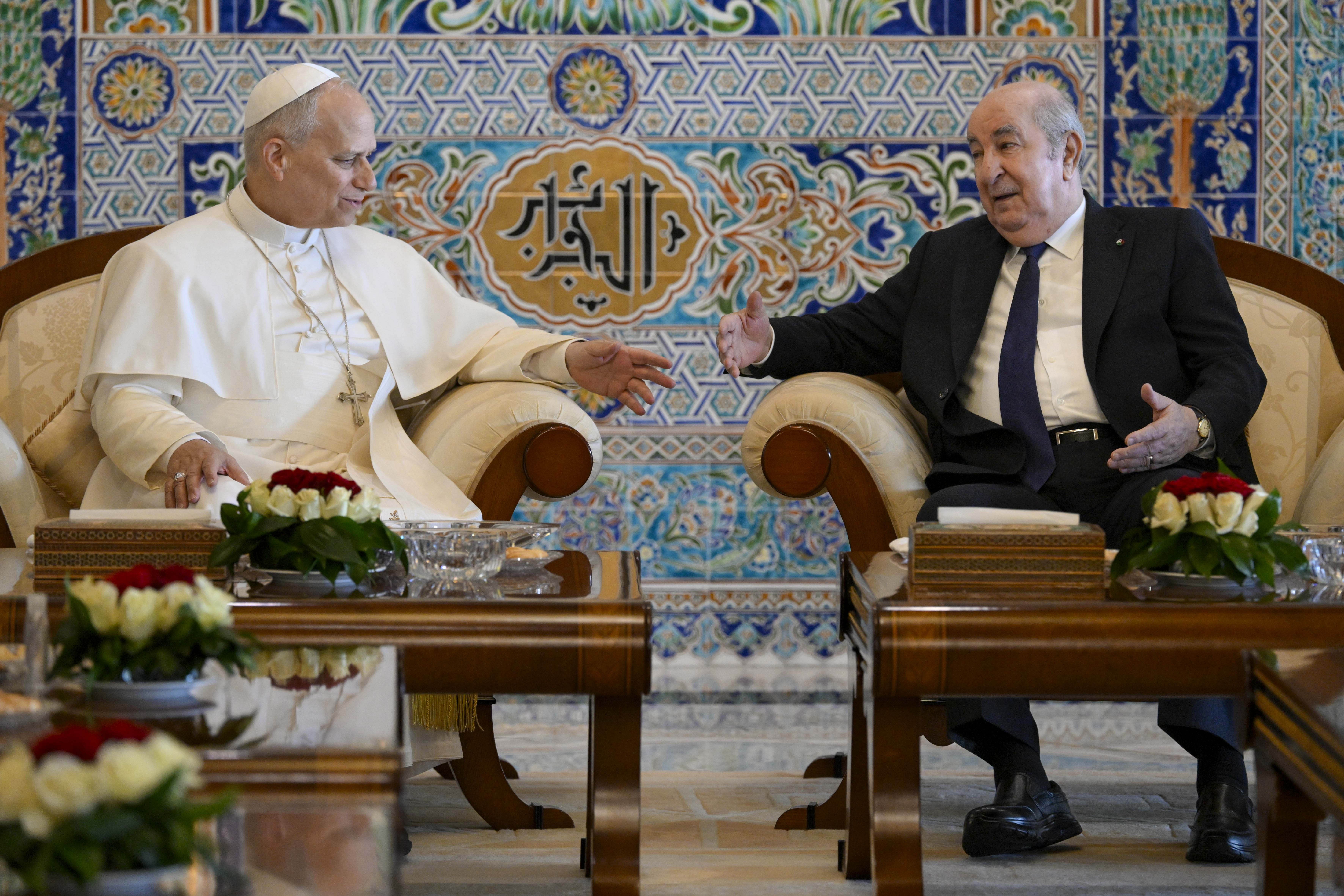Pope Leo XIV speaks to Algerian President Abdelmadjid Tebboune at Houari Boumediene International Airport before departing Algeria, Wednesday, April 15, 2026. | Credit: Vatican Media