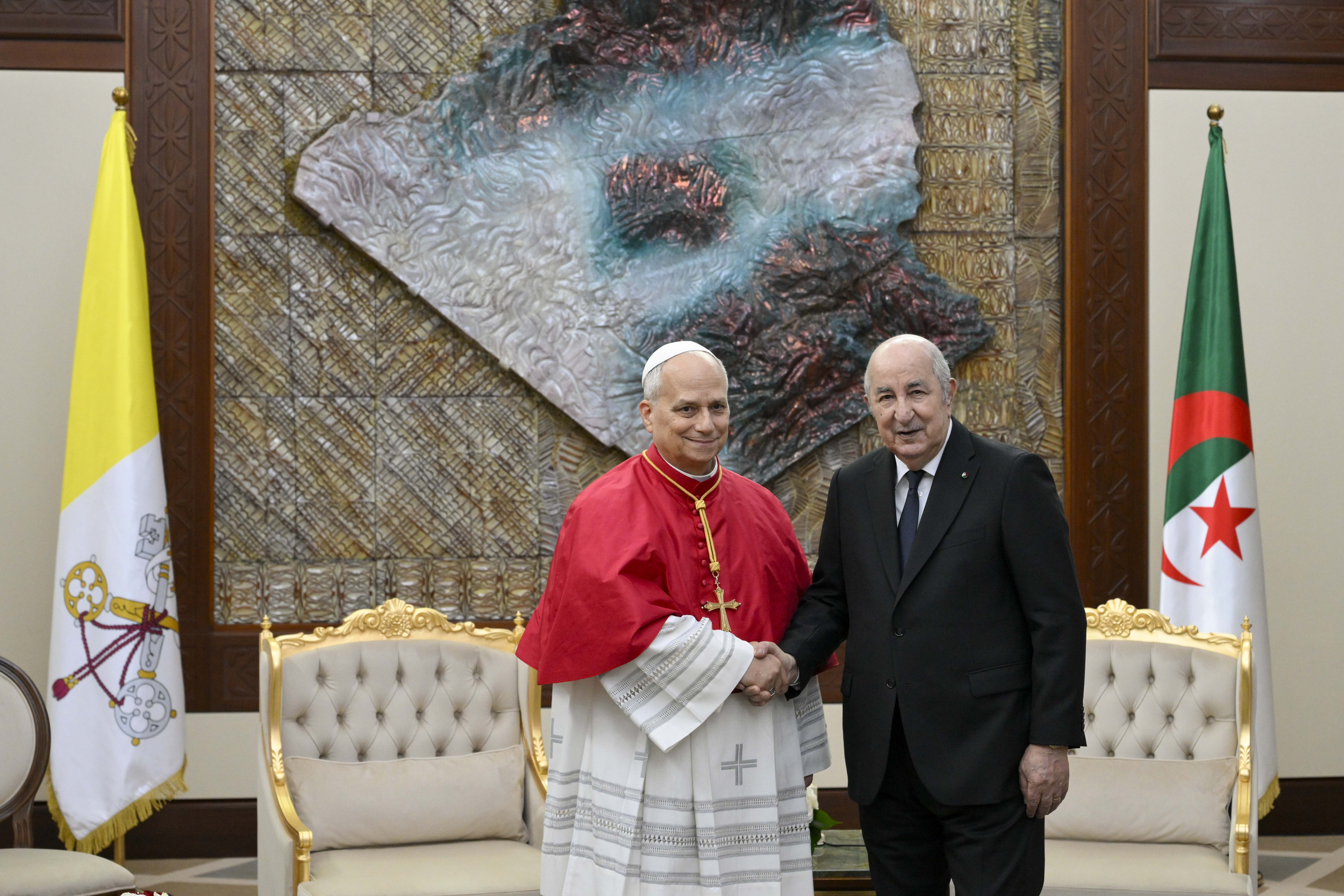 Pope Leo XIV shakes hands with Algerian President Abdelmadjid Tebboune at the Presidential Palace in Algiers, Monday, April 13, 2026. | Credit: Vatican Media