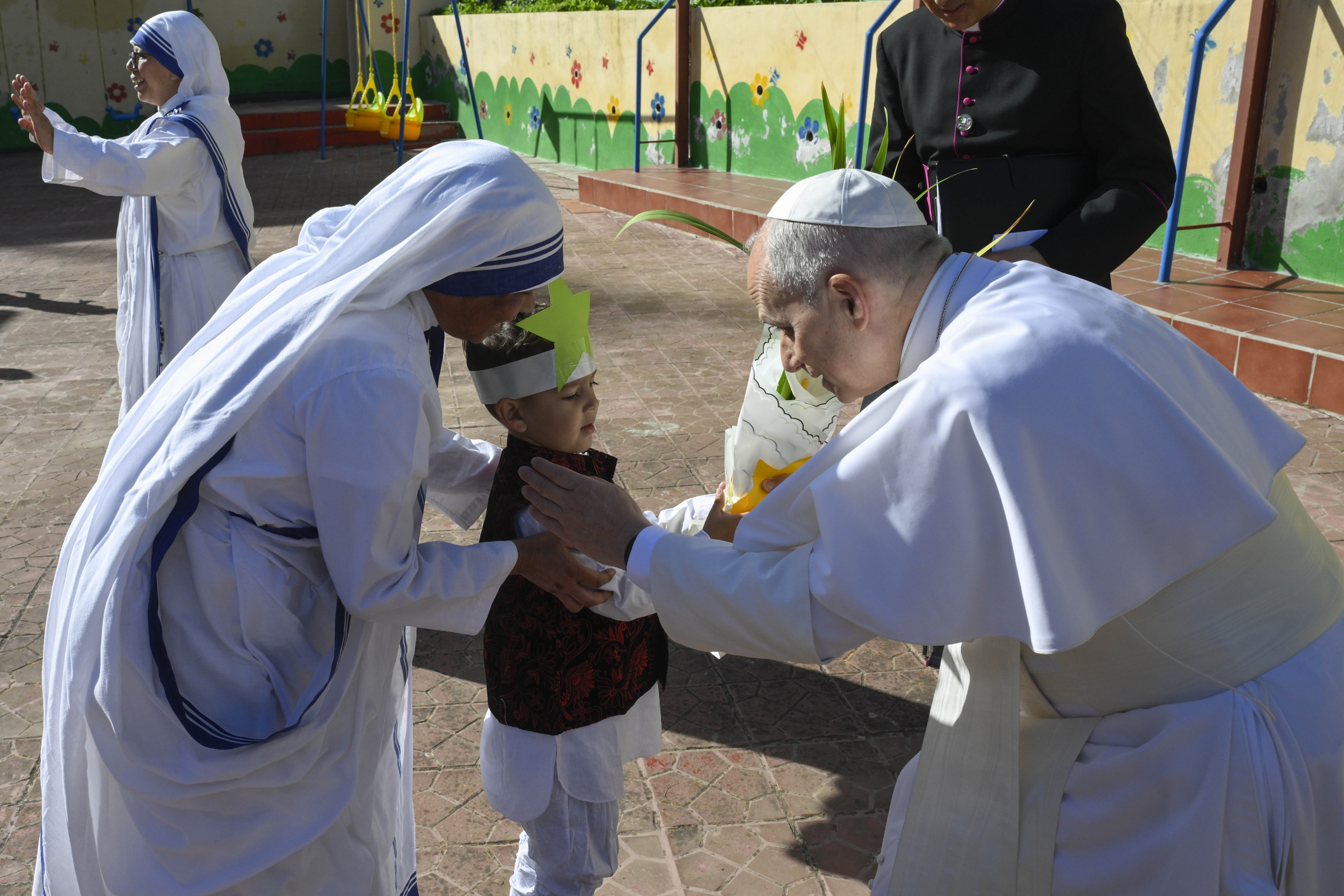 Pope Leo XIV greets a child at the Notre Dame d’Afrique Kindergarten, run by the Missionary Sisters of Charity, near Algiers, Wednesday, April 15, 2026. | Credit: Vatican Media