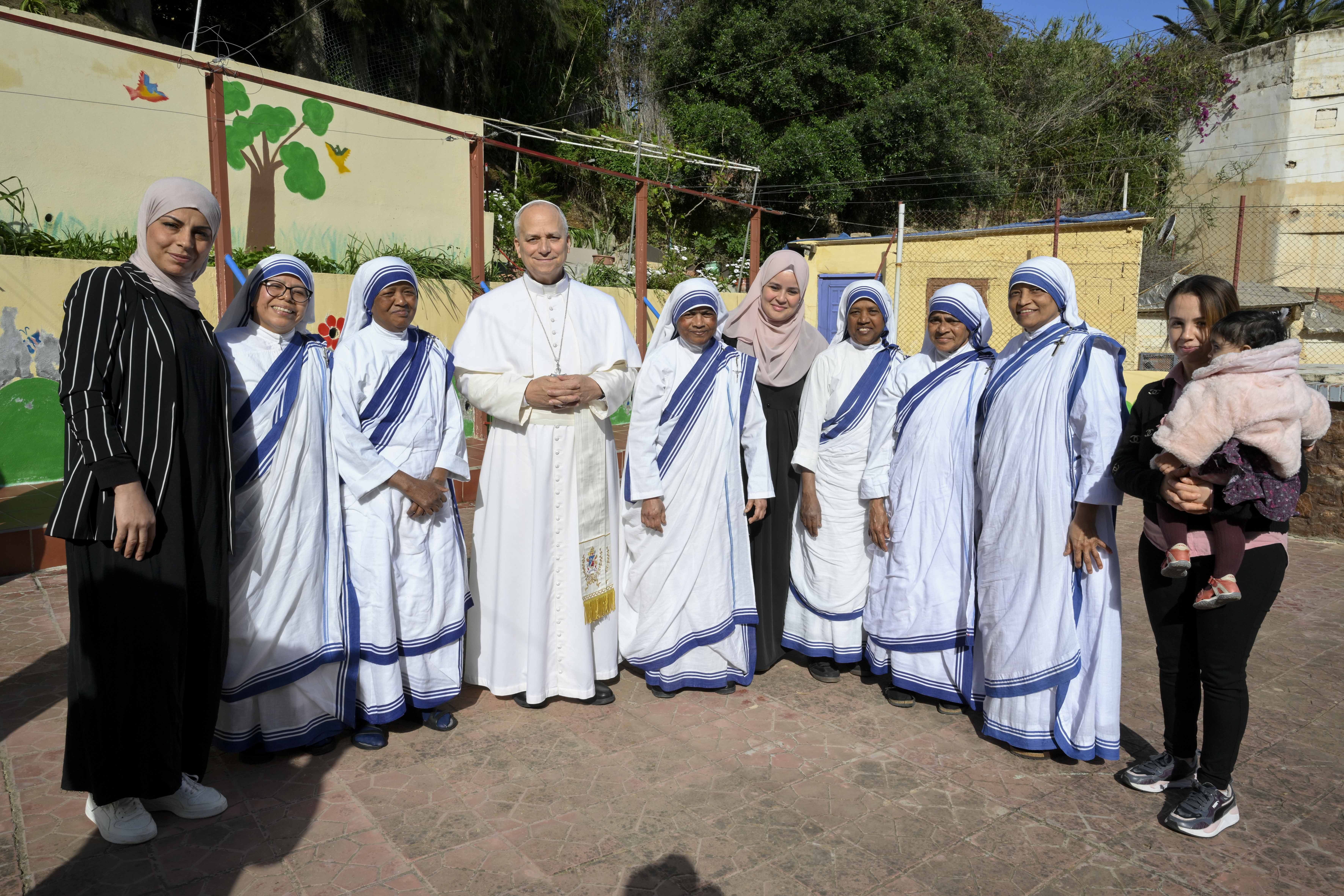 Pope Leo XIV poses with religious sisters at the Notre Dame d’Afrique Kindergarten, run by the Missionary Sisters of Charity, near Algiers, Wednesday, April 15, 2026. | Credit: Vatican Media