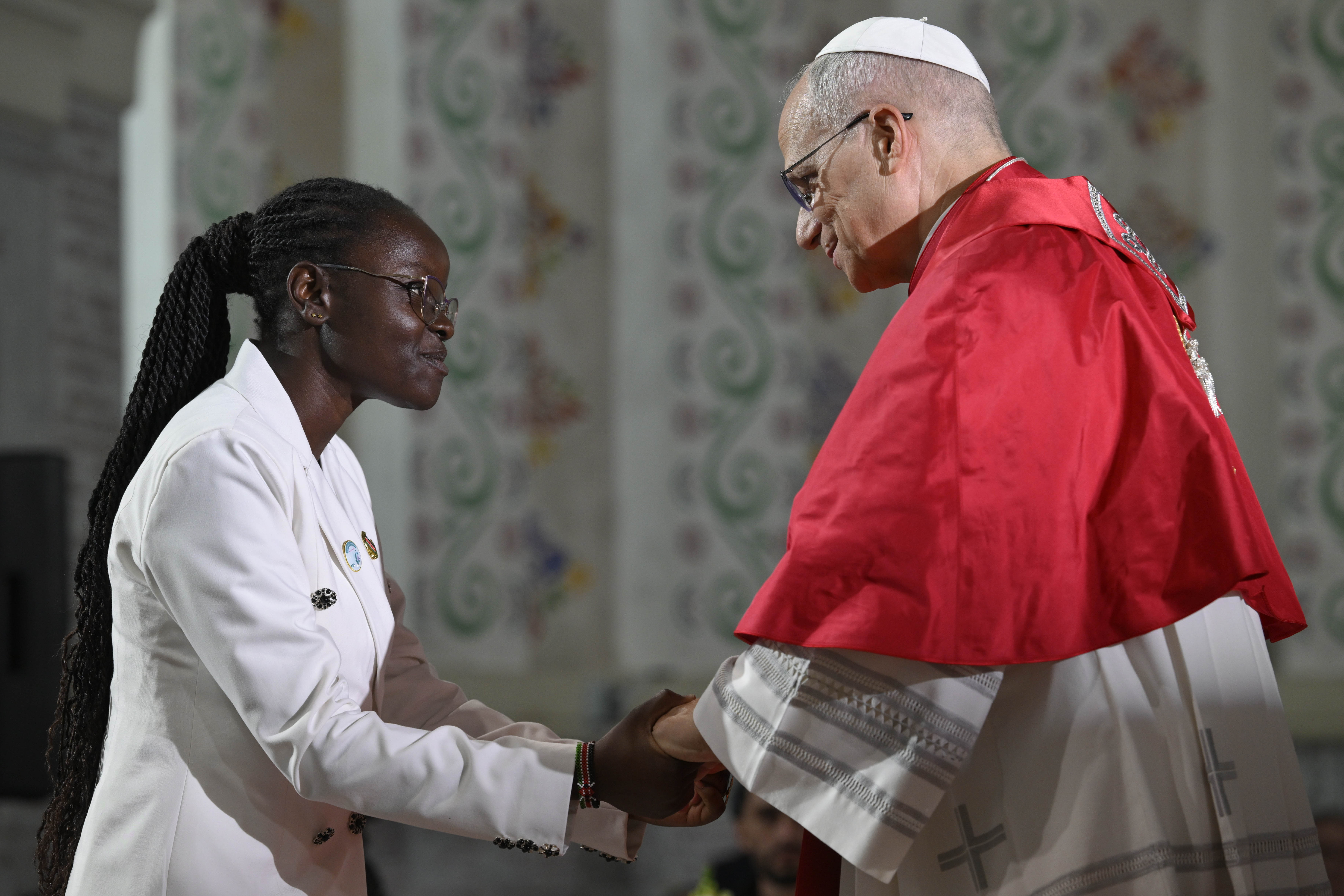 Pope Leo XIV greets a member of the Algerian Catholic community at the Basilica of Our Lady of Africa in Algiers, Algeria, Monday, April 13, 2026. | Credit: Vatican Media