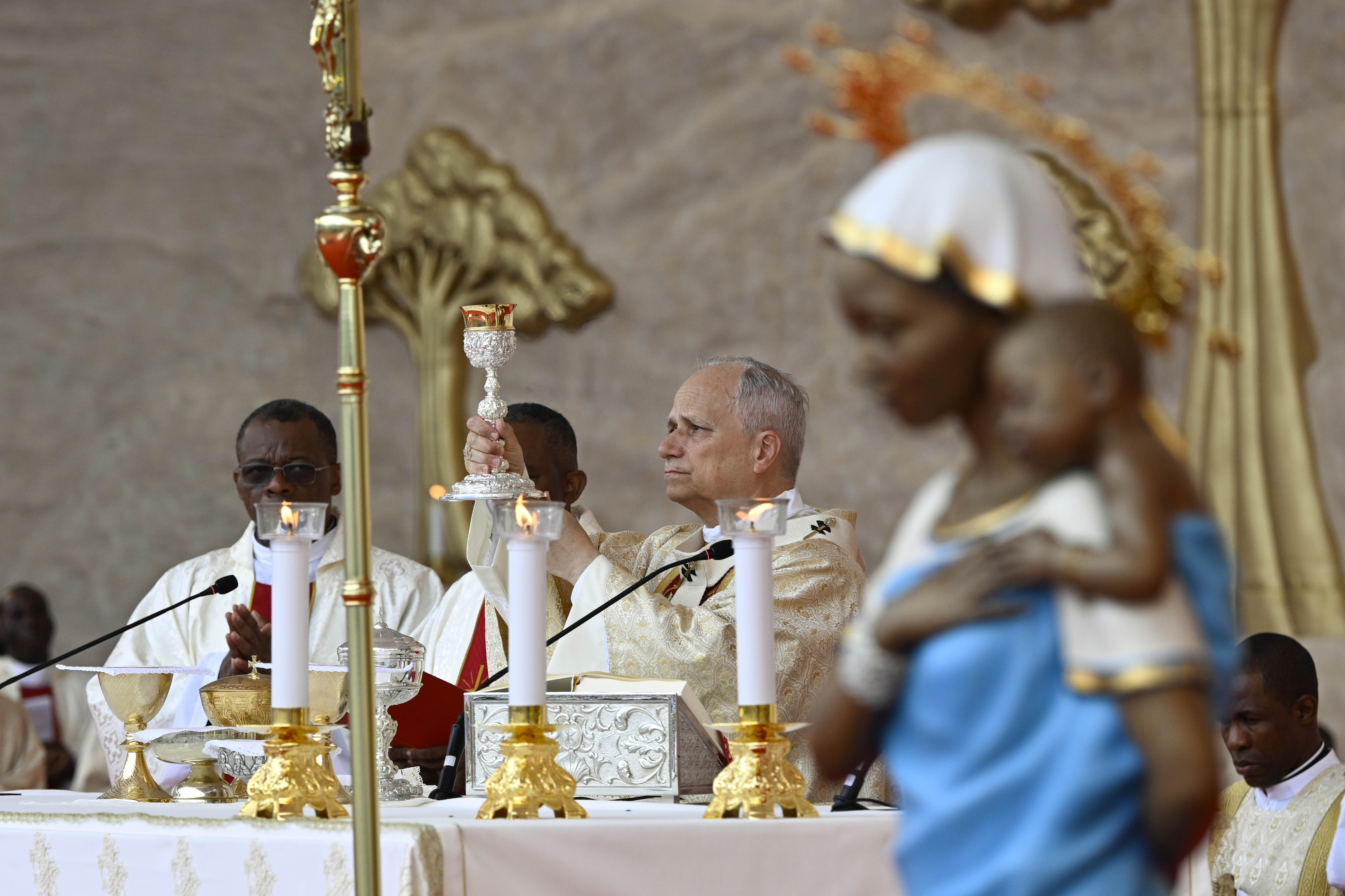 Pope Leo XIV holds the chalice aloft during Mass at Malabo Stadium in Equatorial Guinea, Thursday, April 23, 2026. | Credit: Vatican Media