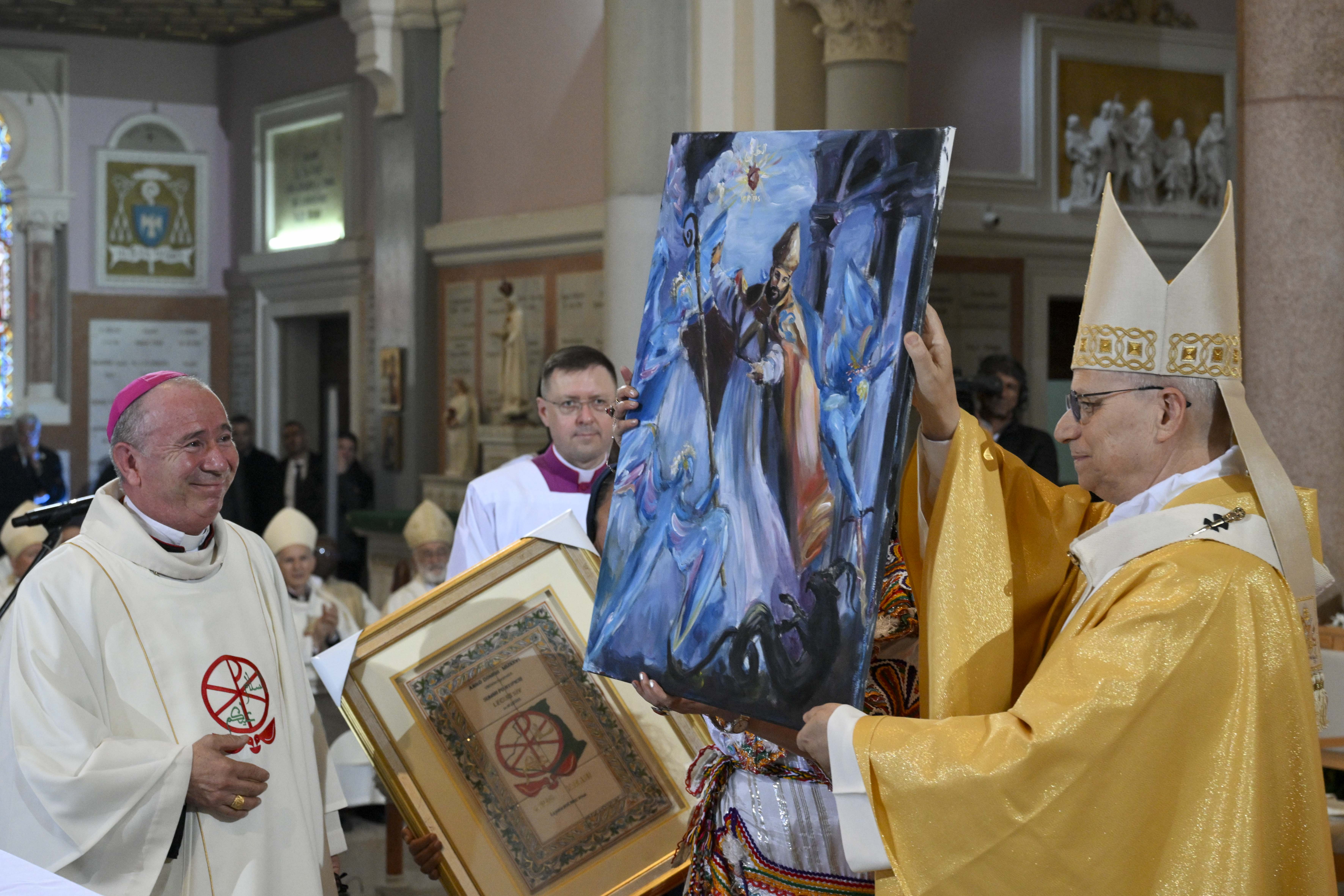 Pope Leo XIV receives a painting at the Basilica of St. Augustine in Annaba, Algeria, Tuesday, April 14, 2026. | Credit: Vatican Media
