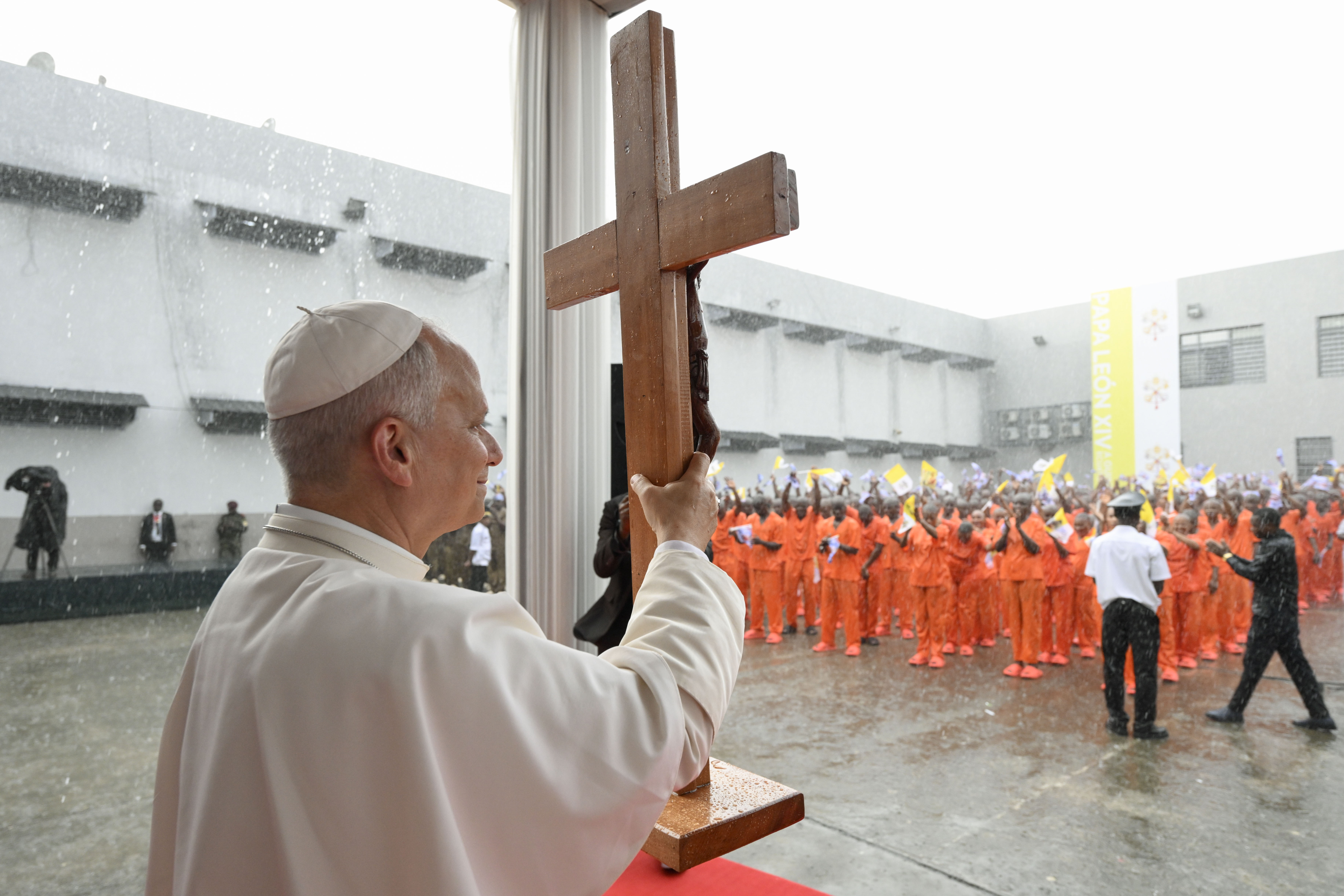 Pope Leo XIV displays a crucifix while speaking to prisoners at Bata Prison, Equatorial Guinea, Wednesday, April 22, 2026. | Credit: Vatican Media
