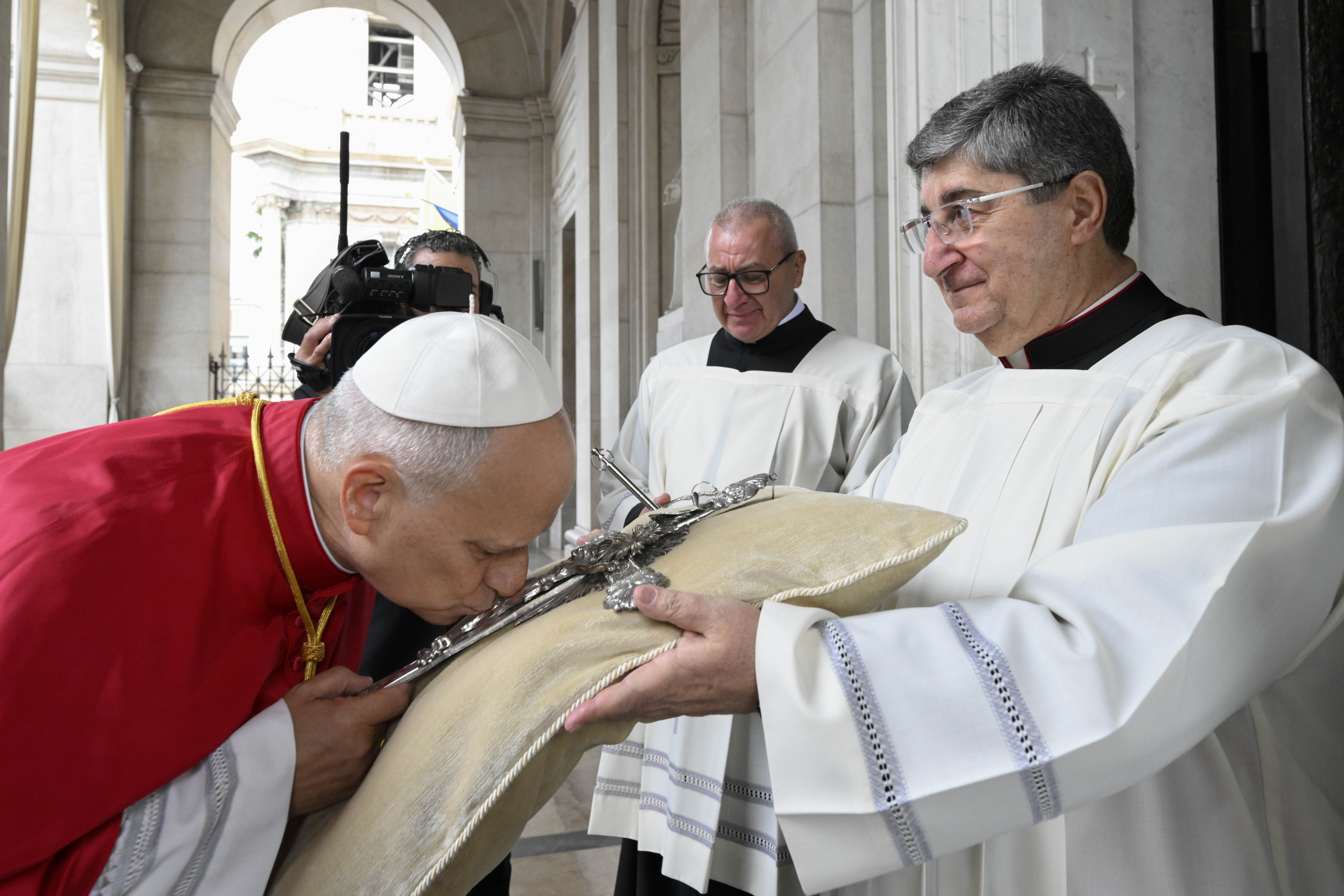 Pope Leo XIV kisses a cross at the Pontifical Shrine of the Blessed Virgin of the Rosary of Pompei, Italy, on Friday, May 8, 2026. | Credit: Vatican Media