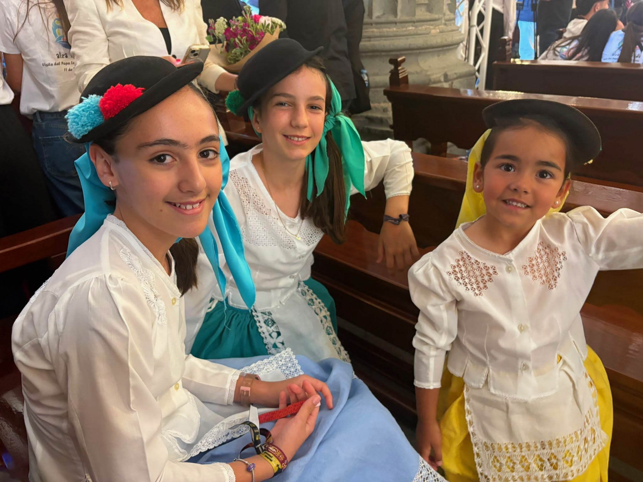 The three Canarian girls dressed in traditional costumes who welcomed the pope at the cathedral. | Credit: Victoria Cardiel/EWTN News