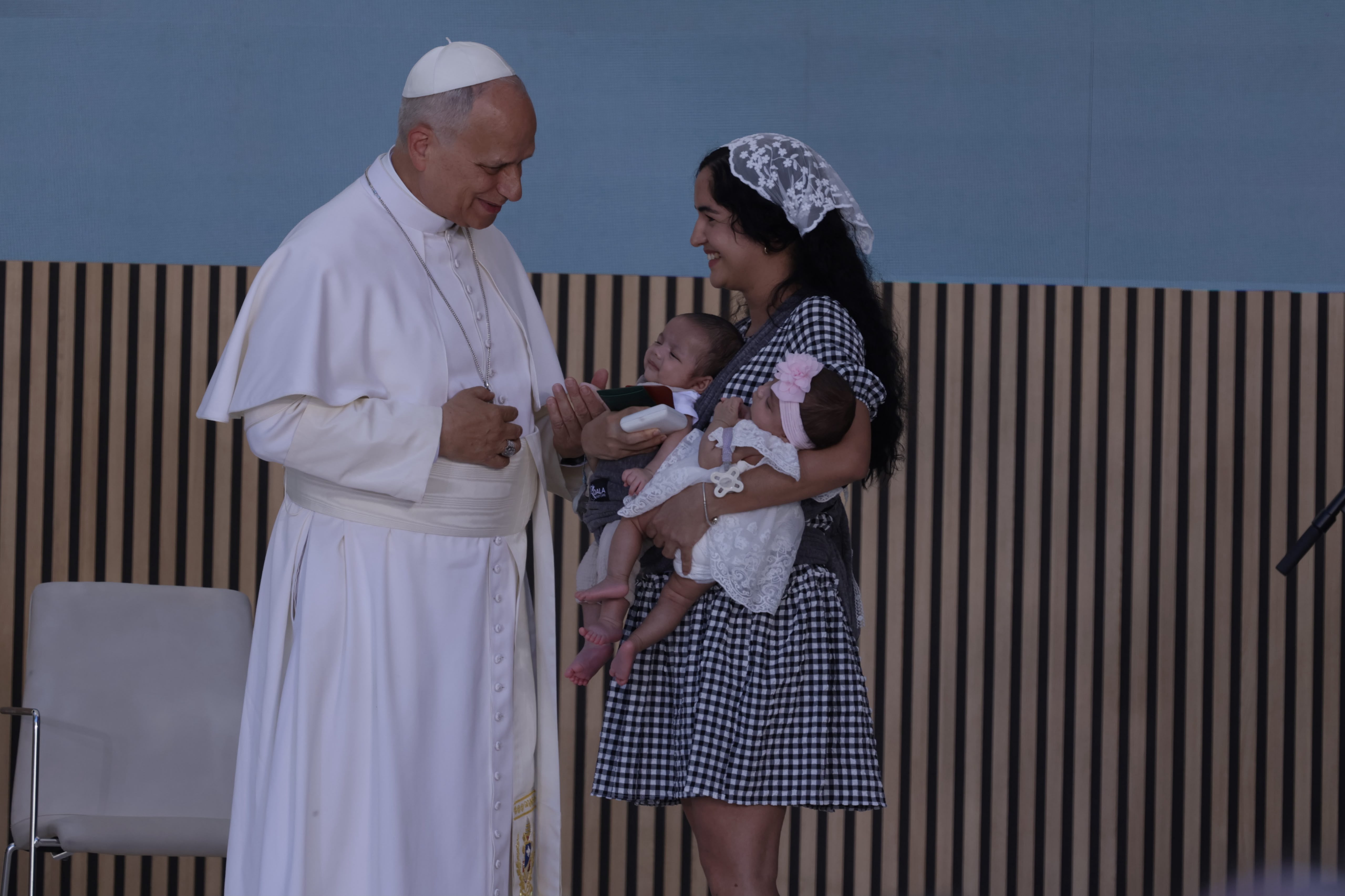 Pope Leo XIV meets a woman from Cuba and her twin babies during an encounter with staff and beneficiaries, including migrants, of the CEDIA 24 Horas center, part of the Caritas of the Archdiocese of Madrid in Spain on June 6, 2026. | Credit: Daniel Ibanez/EWTN News