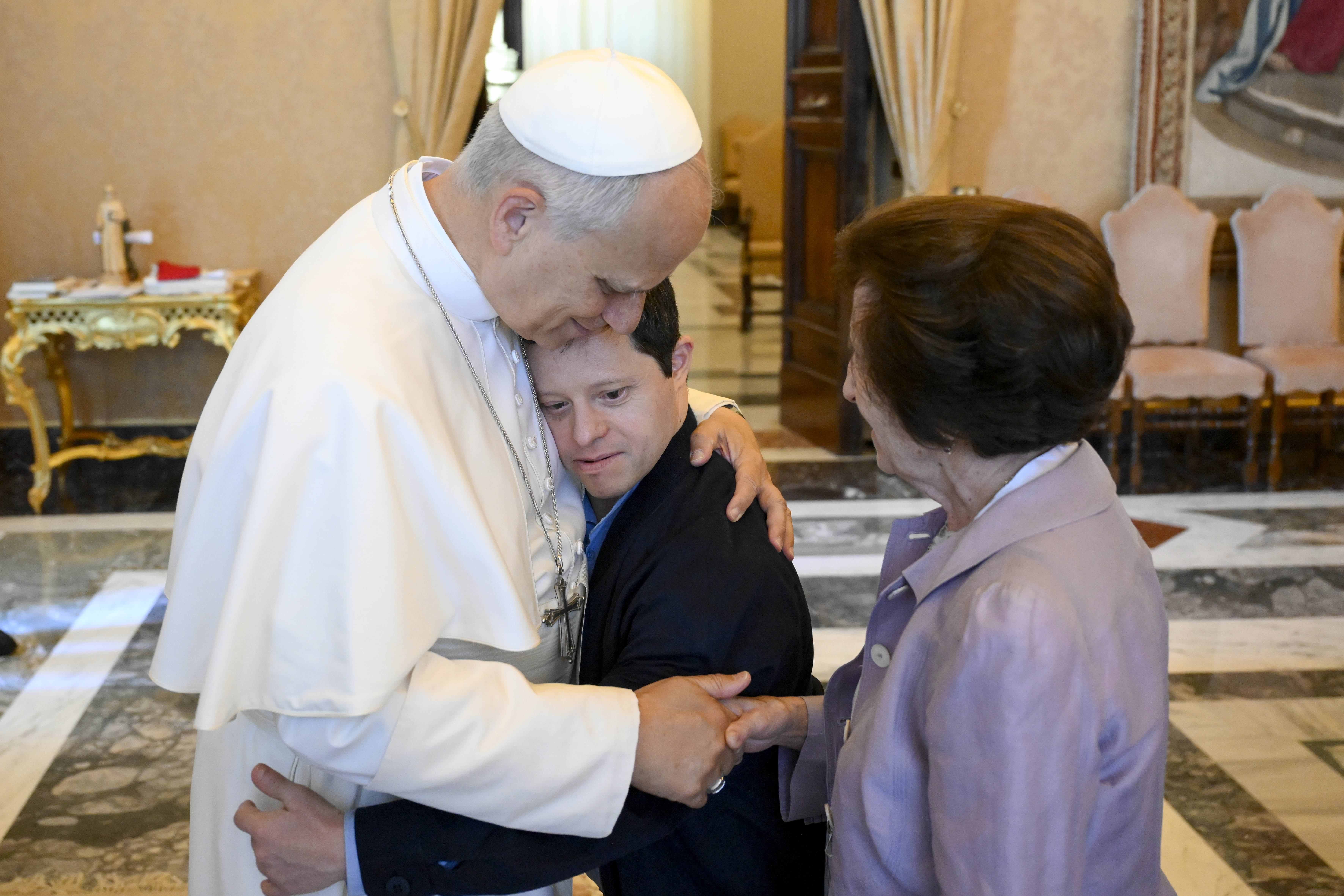 Pope Leo XIV embraces a participant in his audience with members of the Jérôme Lejeune Foundation in the Apostolic Palace at the Vatican on June 22, 2026. | Credit: Vatican Media