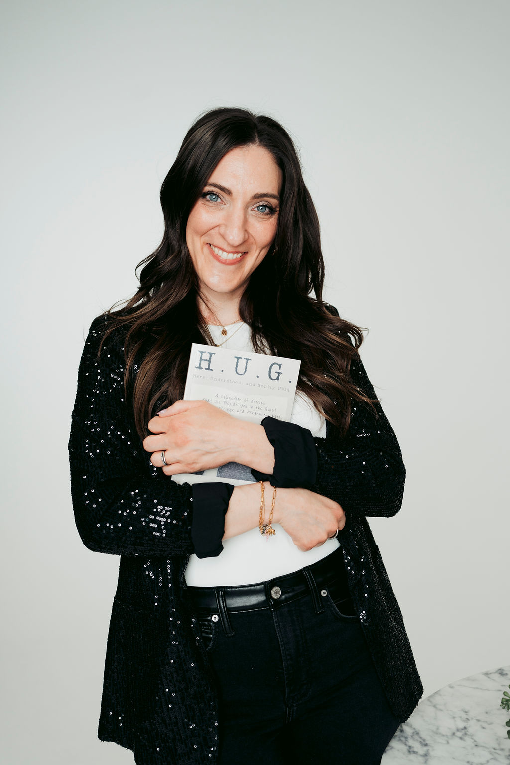 Catholic author Sarah-Elizabeth Pilato with her book, “H.U.G.” | Credit: Tatiana Ariola Photography