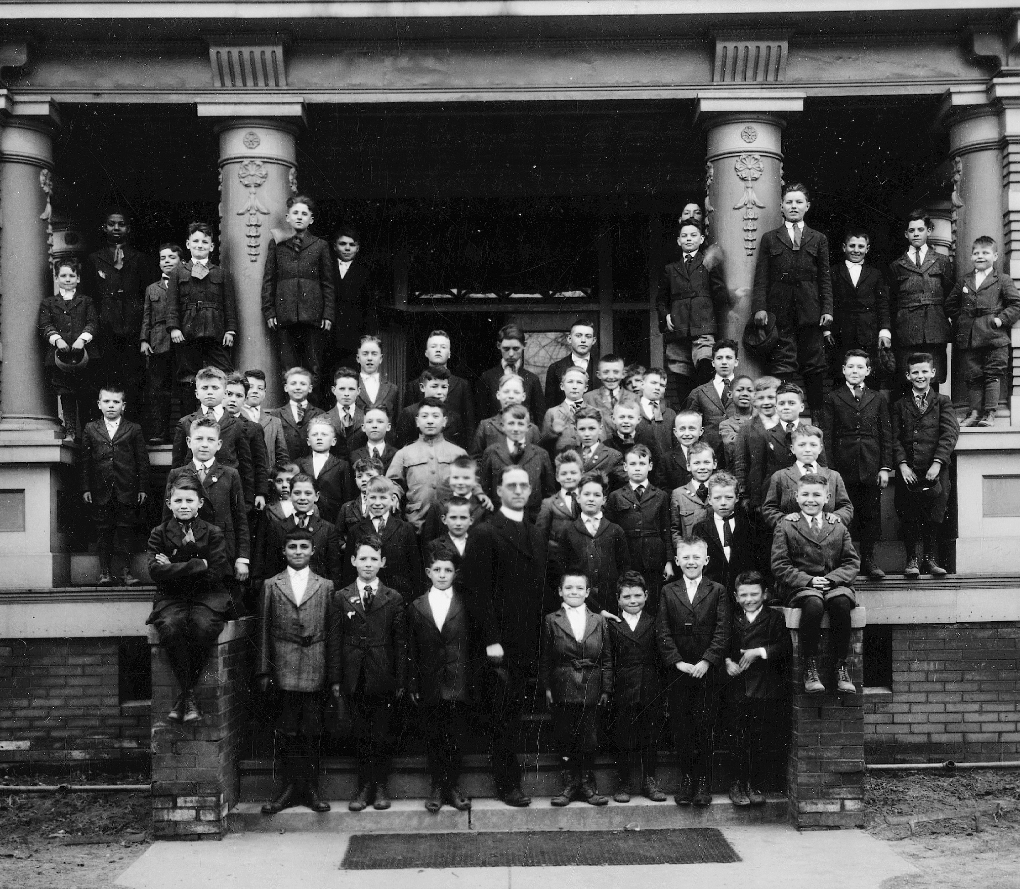 Father Edward J. Flanagan and boys at the German-American Home in South Omaha, which served as Flanaganʼs Home for Boys from 1918 to 1921. Photo courtesy of Boys Town.