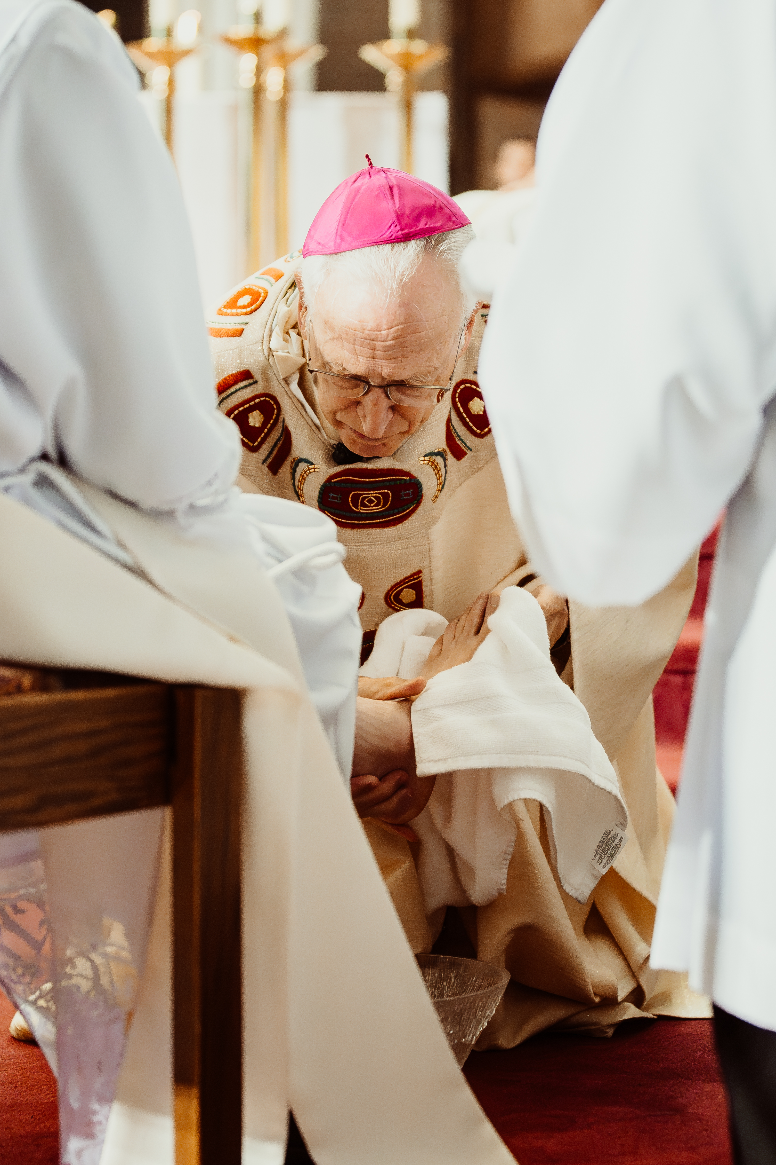 Bishop Earl Boyea of Lansing, Michigan, washes the feet of one of the four men he ordained to the priesthood on June 6, 2026, at St. Thomas Aquinas Parish in East Lansing, Michigan. | Credit: Valerie Hendrickson