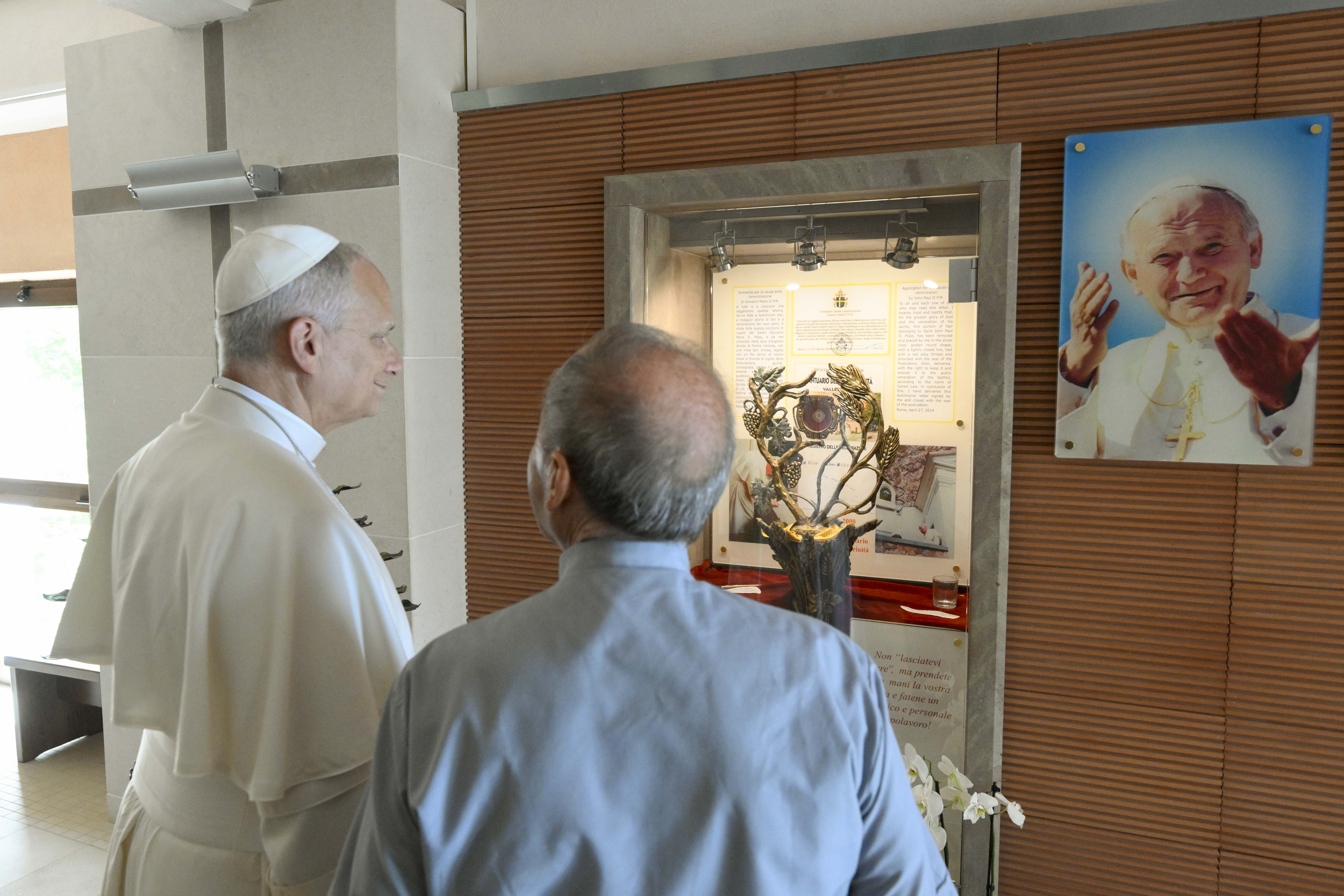 Pope Leo XIV stands before a reliquary of St. John Paul II at the Sanctuary of the Most Holy Trinity at Vallepietra in Italy on July 22, 2026. | Credit: Vatican Media
