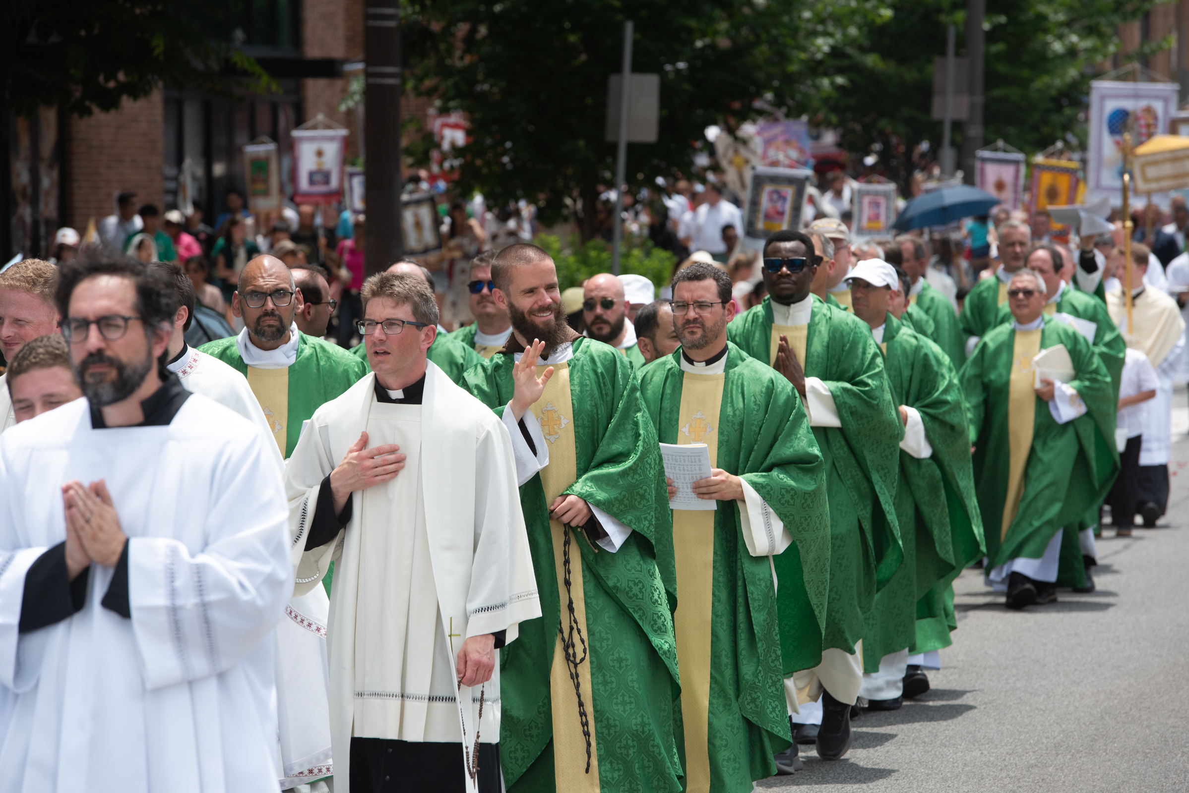 Priests walk in the midday heat during the Eucharistic procession following the closing Mass of the 2026 National Eucharistic Pilgrimage in Philadelphia, Sunday, July 5, 2026. | Credit: Jeffrey Bruno