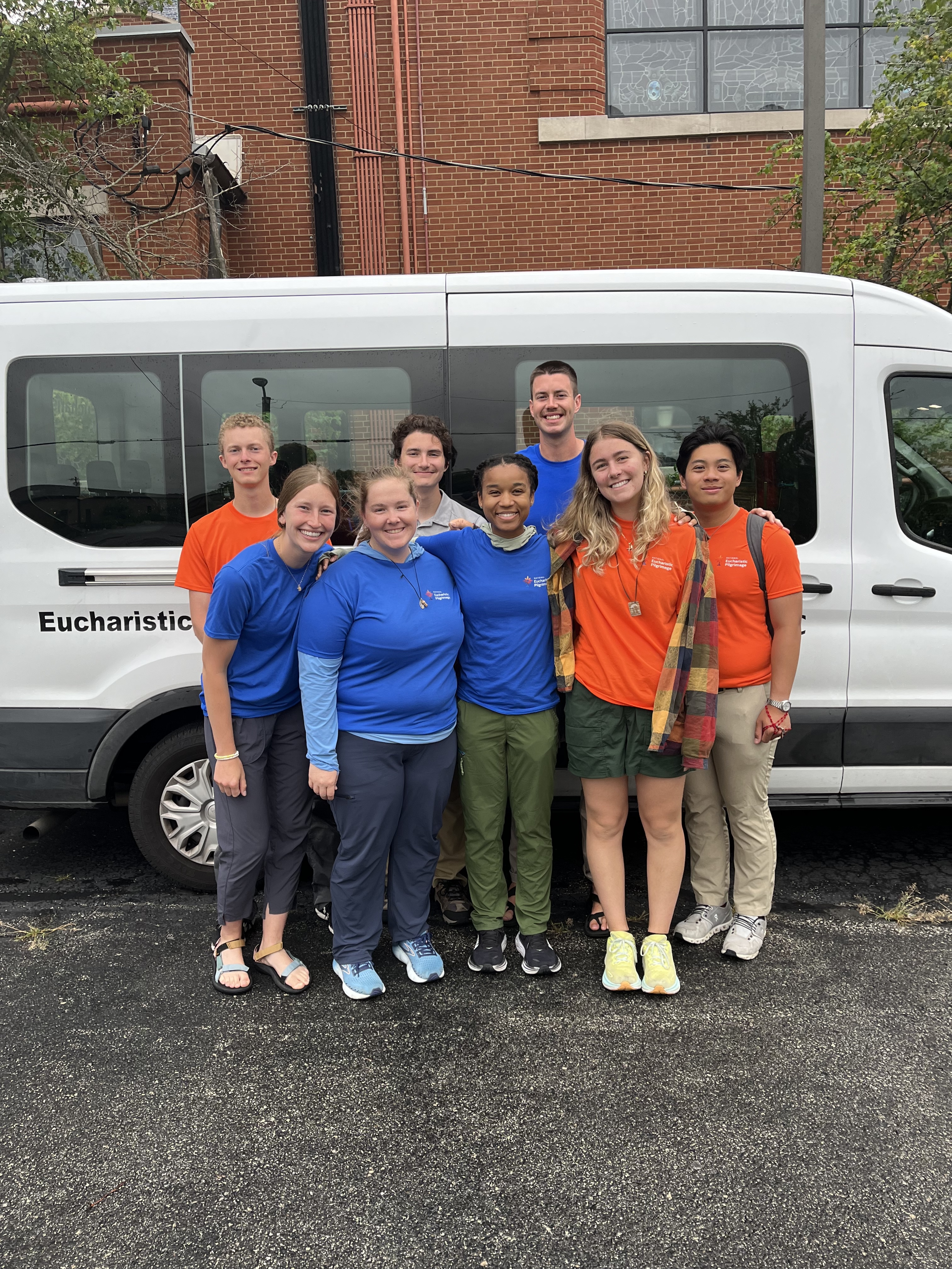 MacKenzie Warrens, middle, stands with the group of Perpetual Pilgrims after completing the Diego Route in July 2024.| Credit: Photo courtesy of National Eucharistic Congress, Inc.