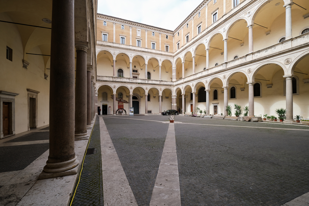 The courtyard of the Palazzo della Cancelleria, a Renaissance palace in Rome, which serves as the headquarters of the Supreme Tribunal of the Apostolic Signatura. | Credit: Alexander Reuter/Shutterstock