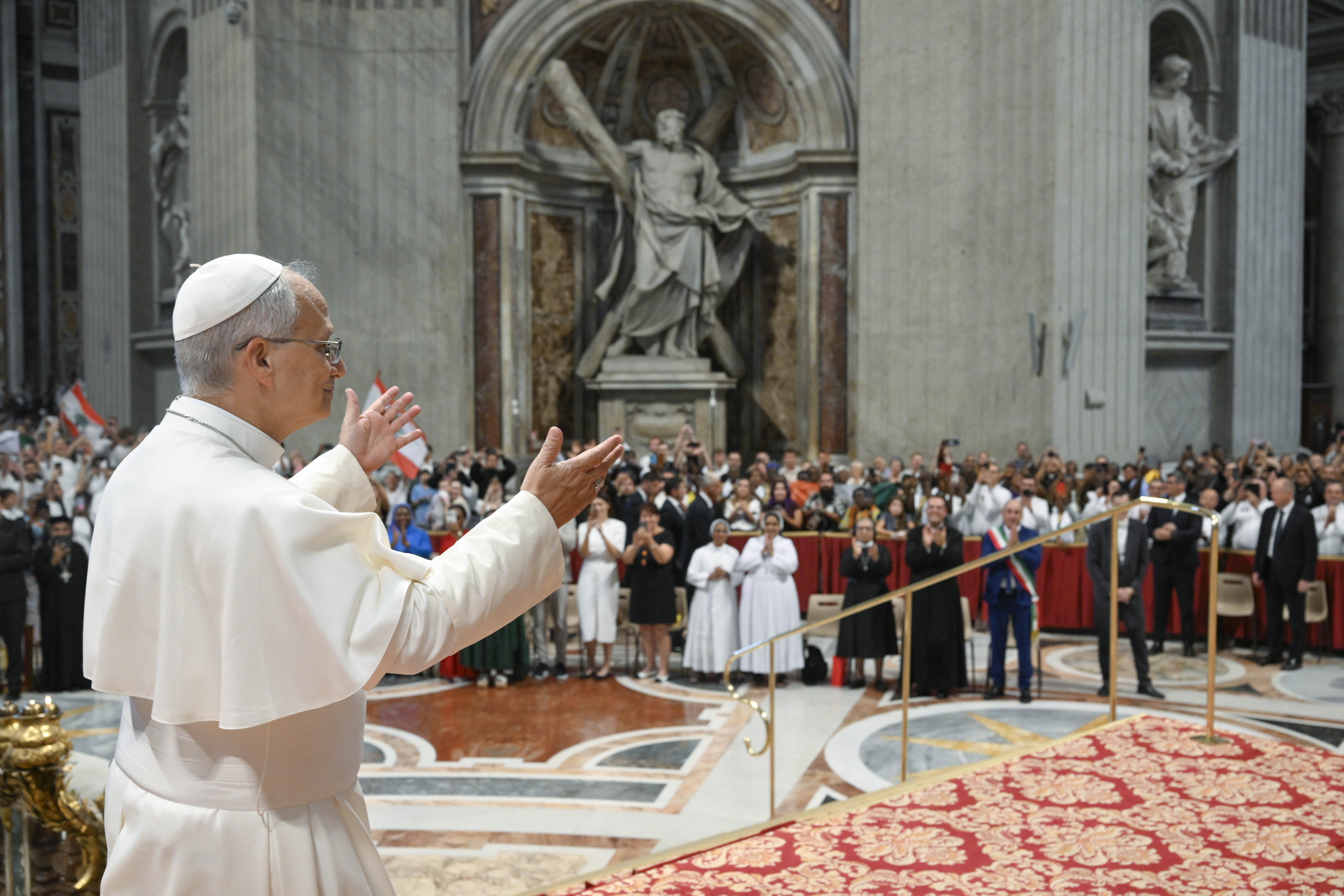 Pope Leo XIV greets the people at his general audience in St. Peter’s Basilica on Aug. 19, 2026. The general audience is being held in the basilica in August to avoid the hot summer temperatures. | Credit: Vatican Media
