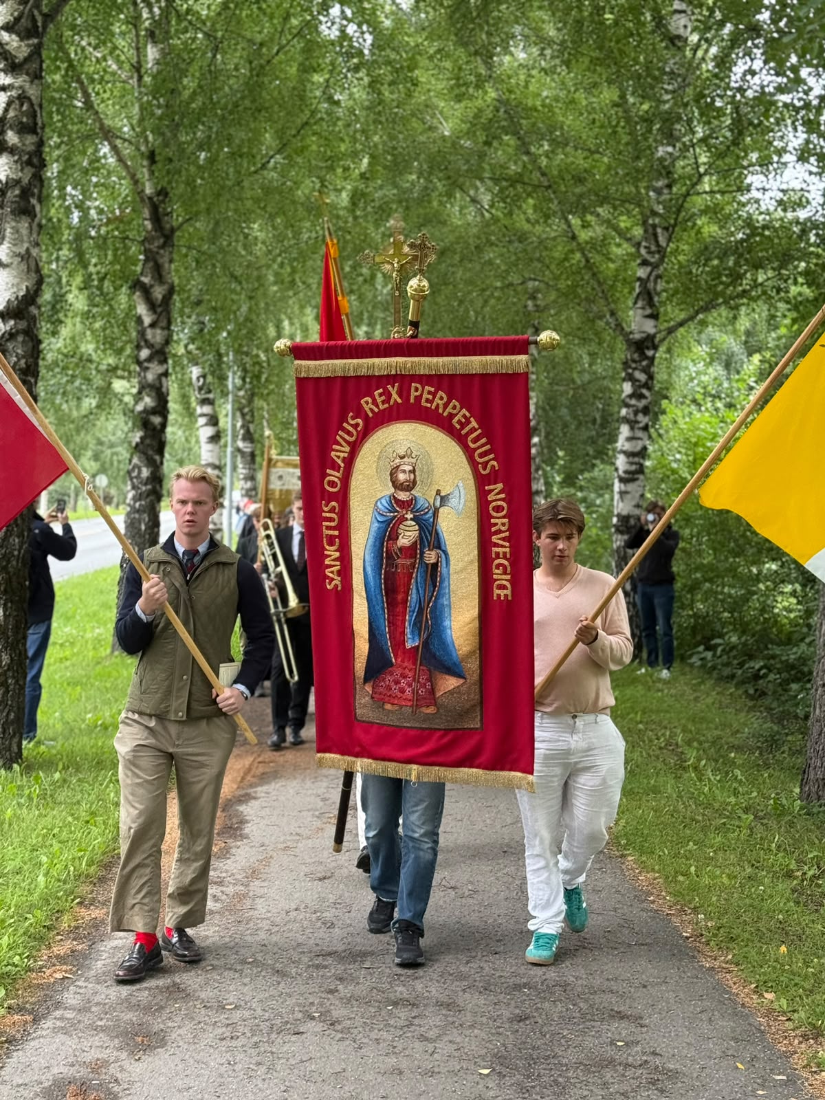 Young Catholics carry a banner reading “Sanctus Olavus Rex Perpetuus Norvegiæ” during a procession marking the feast of St. Olav on July 29, 2026, near Stiklestad, Norway. | Credit: Pål Johannes Nes