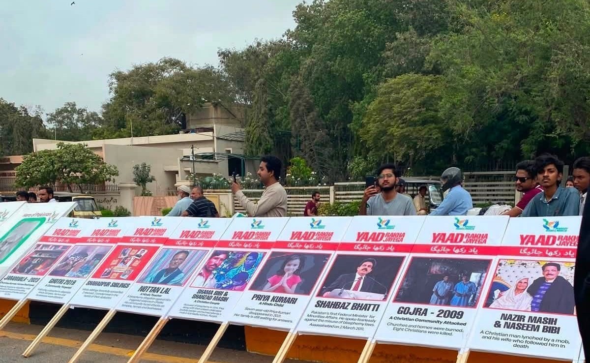 Placards commemorating victims of mob lynchings, forced conversions, blasphemy-related attacks, and assassinated Christian leaders line a National Minorities Day protest at the mausoleum of Pakistan’s founder, Muhammad Ali Jinnah, in Karachi on Aug. 11, 2026. | Credit: Photo courtesy of Luke Victor