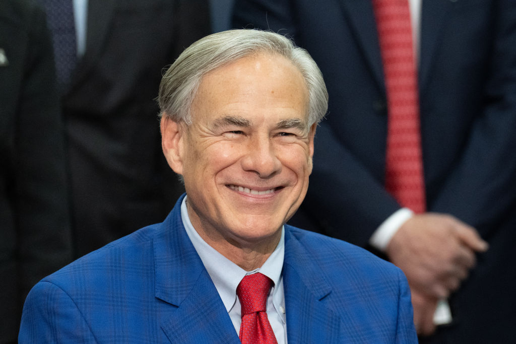 Texas Gov. Greg Abbott smiles during a press conference in Houston on March 26, 2024. | Credit: Suzanne Cordeiro/AFP via Getty Images