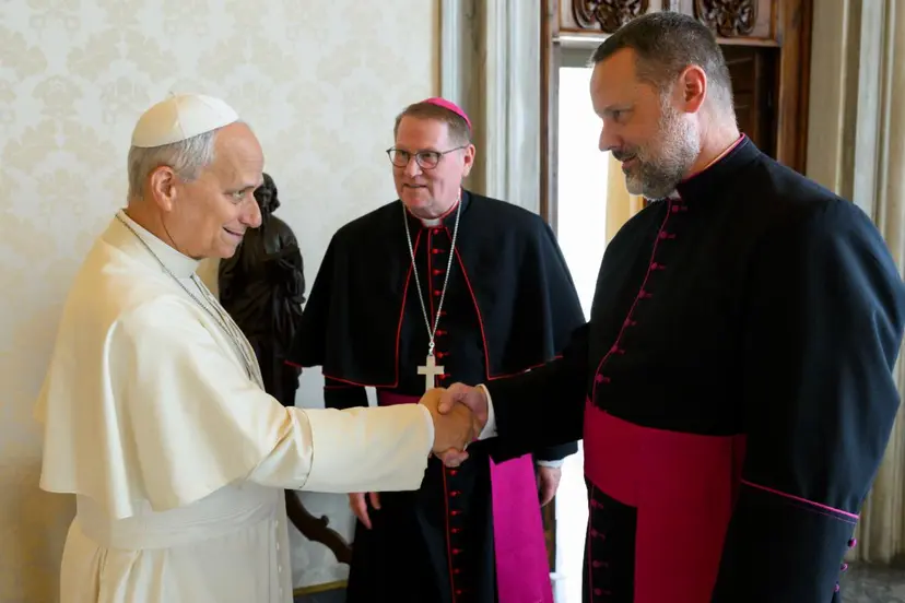Pope Leo XIV shakes Monsignor Jason Gray’s hand while Bishop Louis Tylka looks on during a private audience at the Vatican on Oct. 5, 2026. | Credit: Vatican Media