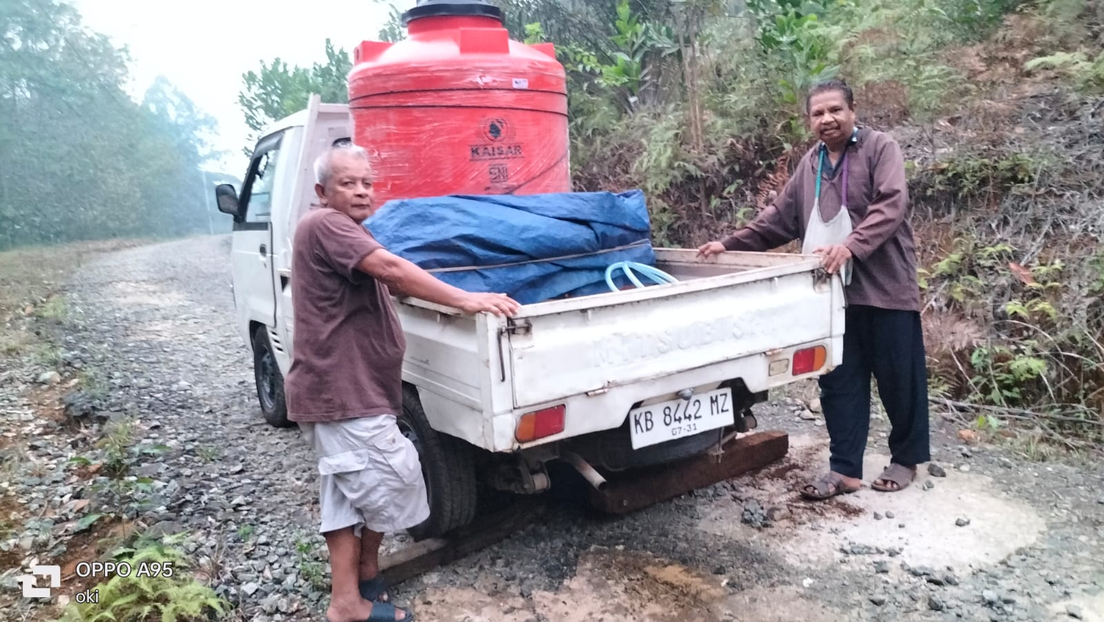 Men load a water tank onto a pickup truck to bring clean water to communities affected by forest and land fires in Kalimantan, Indonesia, 2026. | Credit: Photo courtesy of Friar Taucen Girsang, OFM